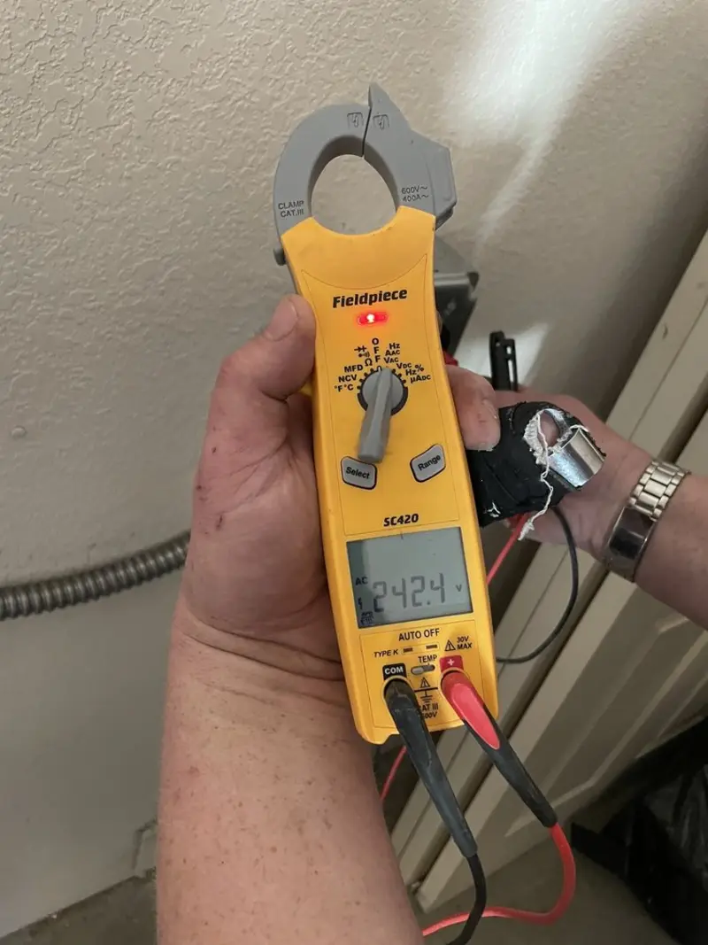 Voltage testing with clamp meter during Whole House Surge Protector in North Bend